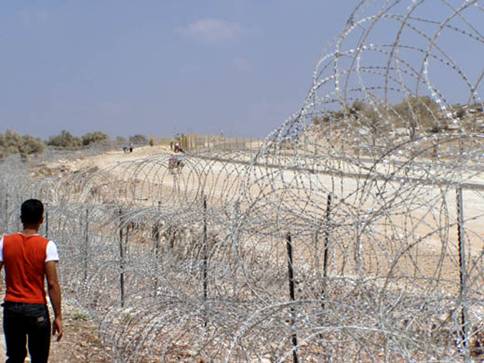 Parts of the wall are made up of large amounts of barbed wire